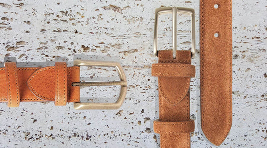 Overlay of 72 Smalldive Suede and Full-Grain Belts On Travertine Marble Slab