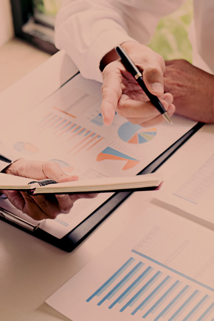 Hands pointing at a report during business meeting 