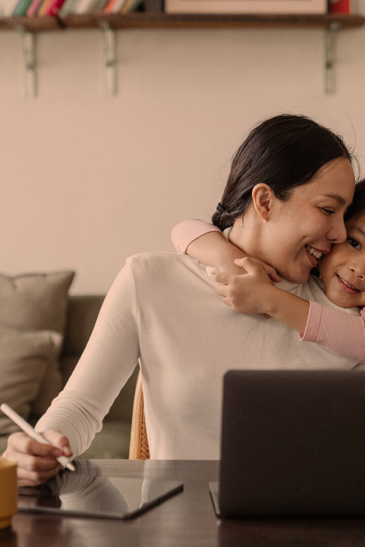 Mum working from home remotely with child