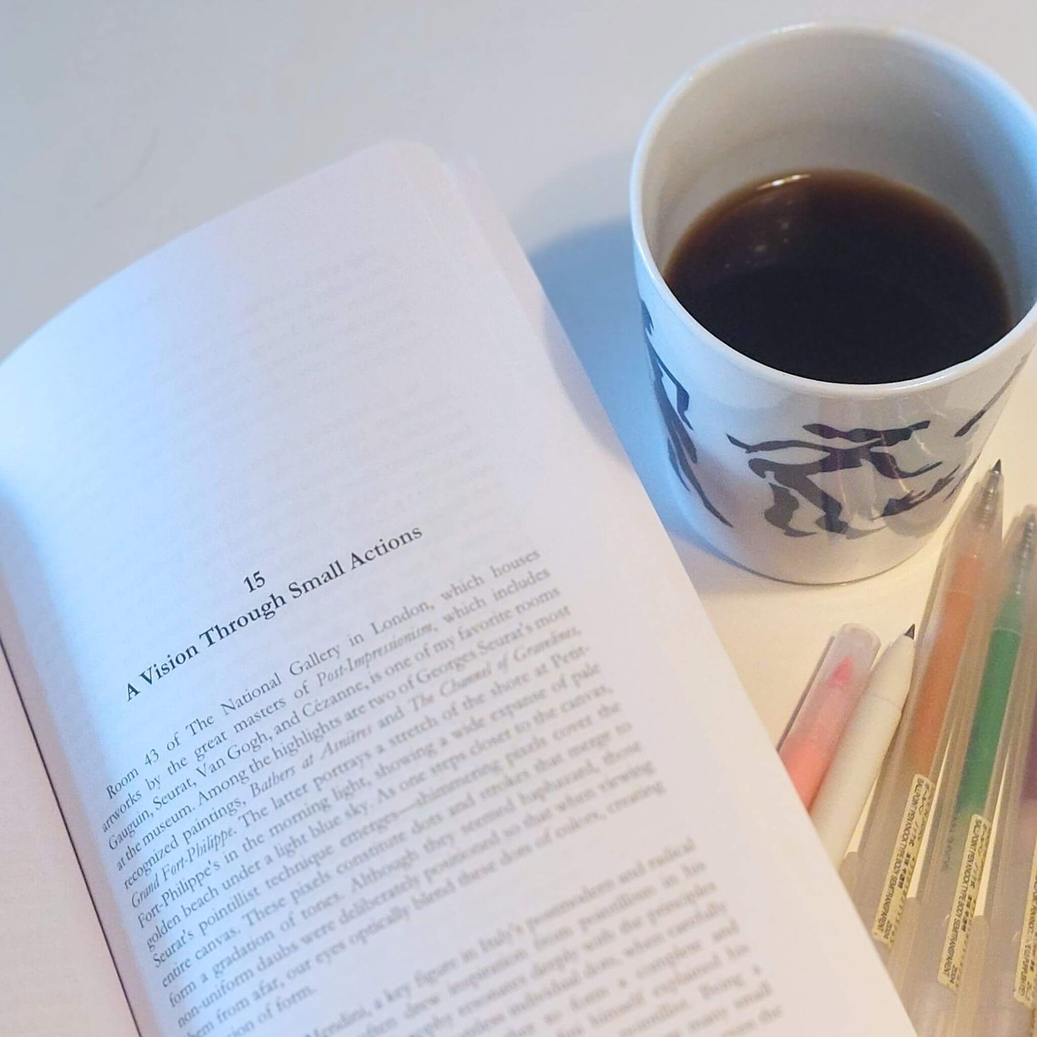 Chapter 15 of Staying H.I.R.E.d - A Vision Through Small Action, next to coffee mug and pens